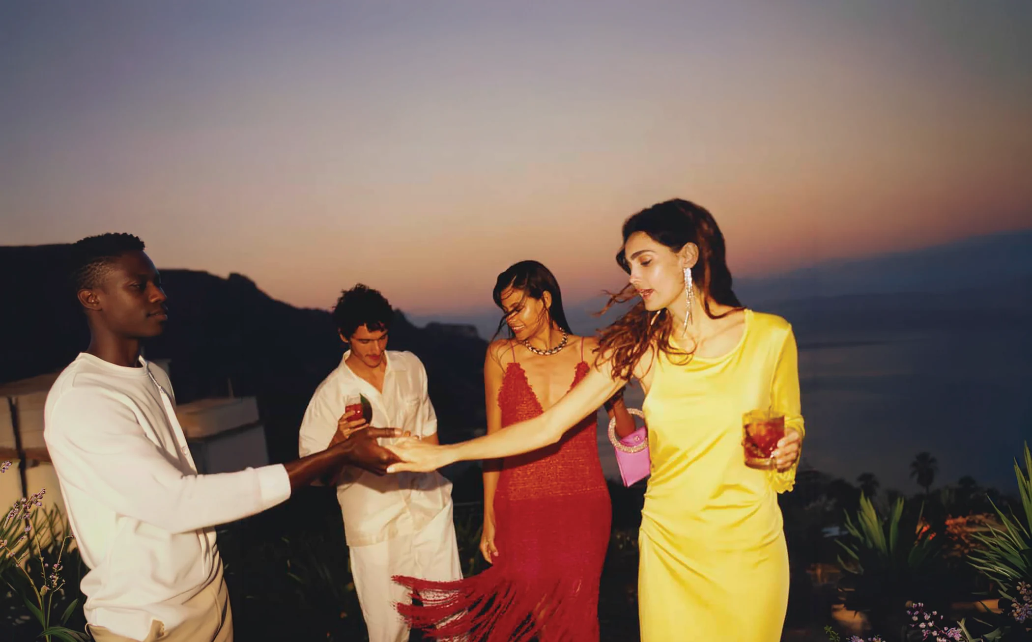 The Travel Tribe sharing a moment together at sunset